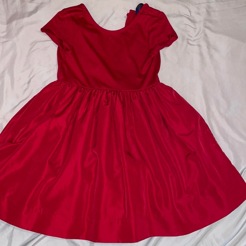This is a red kids polo dress size US 6X